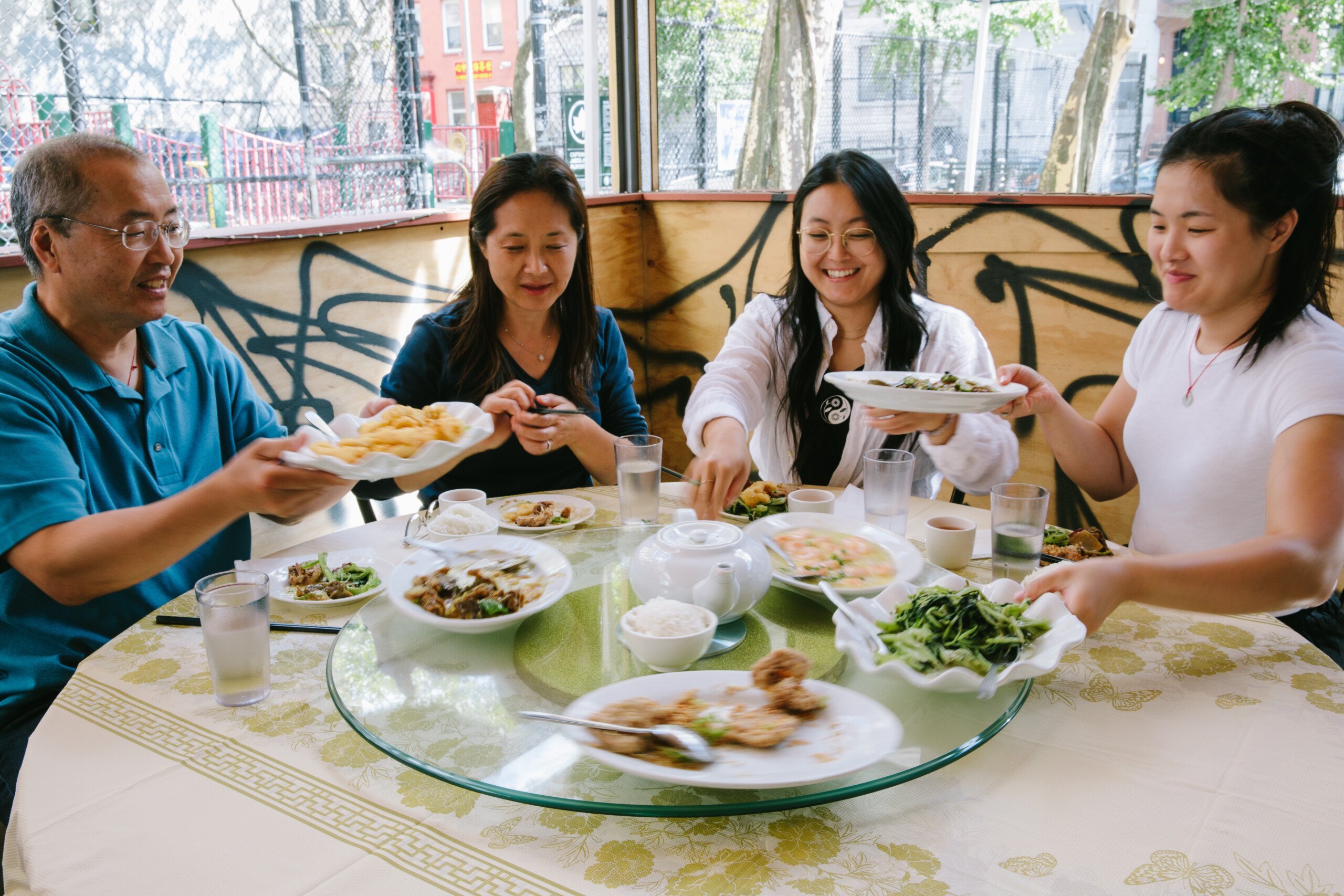 The Woks of Life family eating lunch in Chinatown