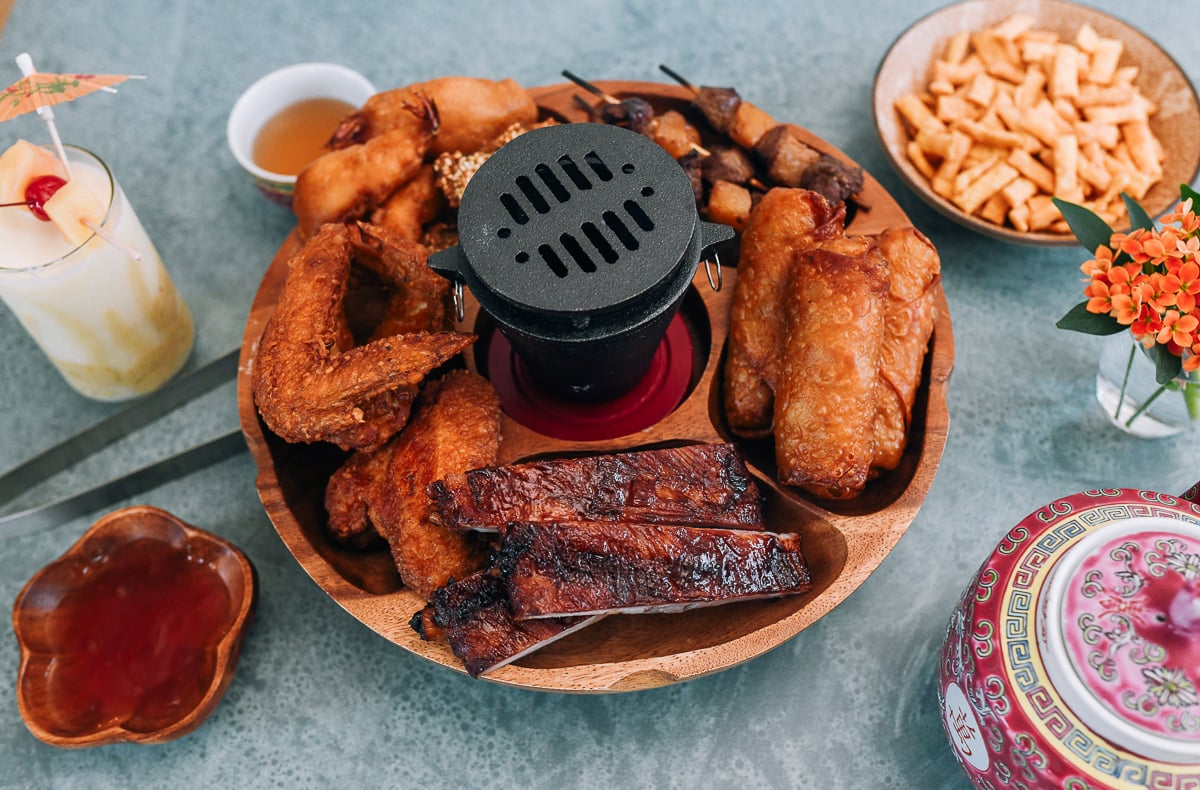 Pupu Platter assembled with ribs, egg rolls, chicken wings, shrimp, and beef stick